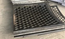 Deformation and Flattening Treatment of Metal Perforated Sheets